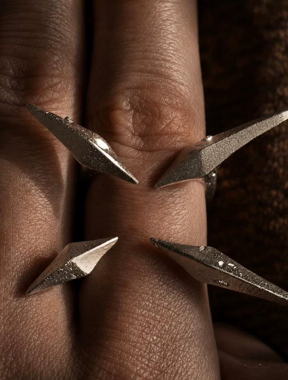 Four-Point Geometry Ring