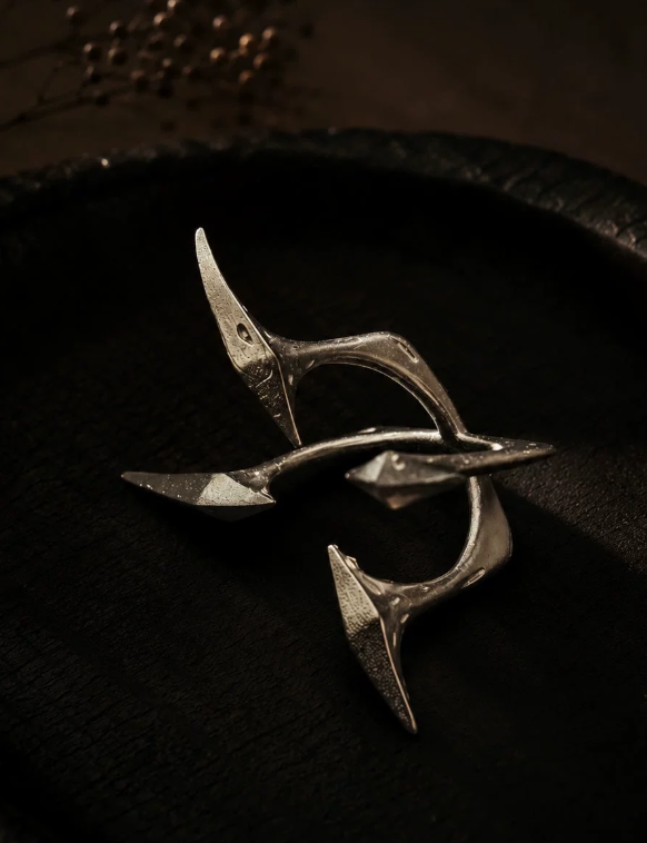Four-Point Geometry Ring
